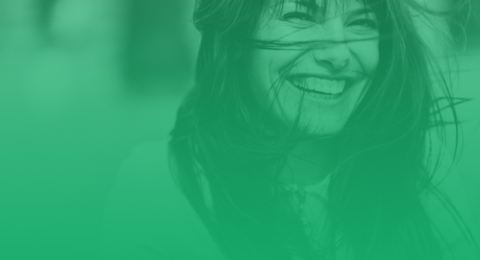 woman smiling with green filter over the photo