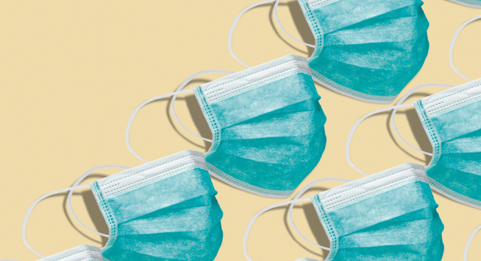 Surgical masks on a yellow background