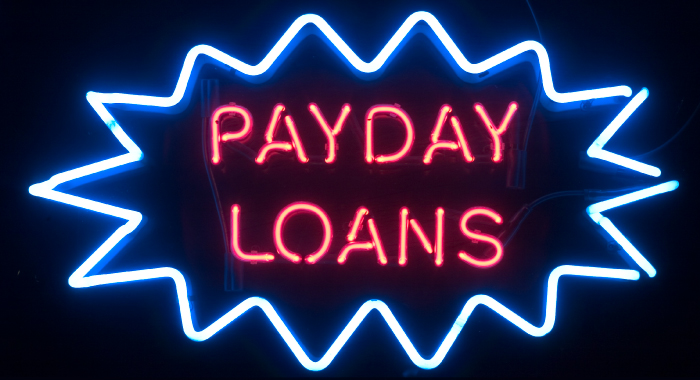 neon sign that says "Payday Loans"